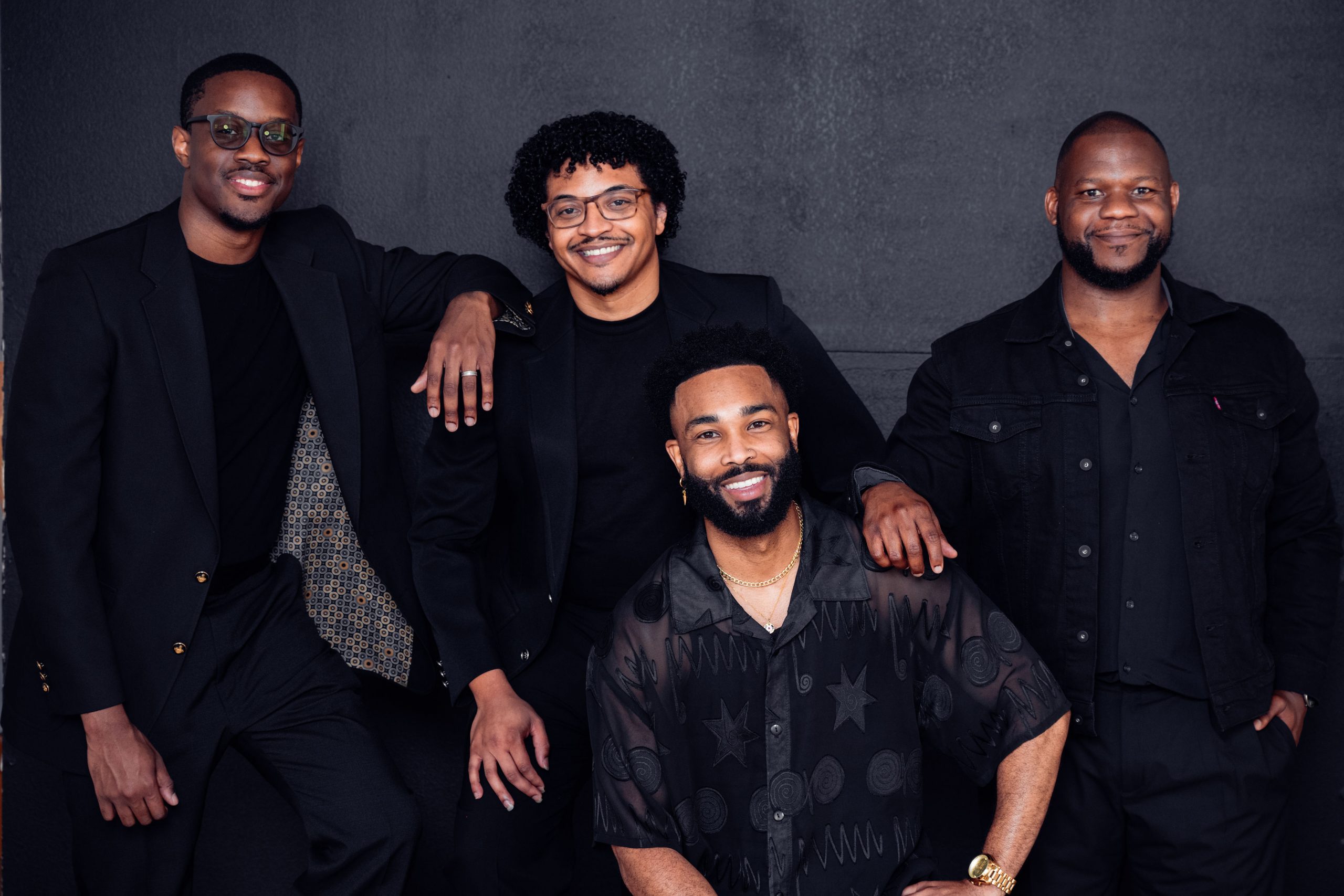 Photo of members of Kings return in black against a gray background.